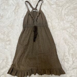 Green Spaghetti strap dress with discreet print on body.